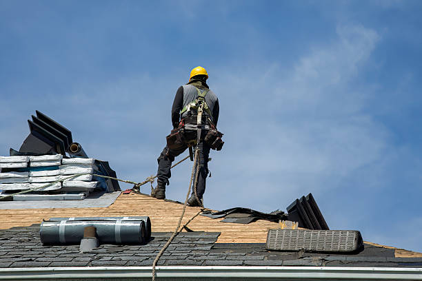 Professional Roof Replacement technician working in Raynham, MA